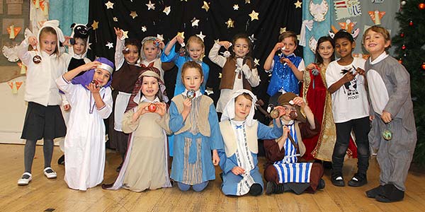 Children from Walton on the Hill Primary School create hand decorated Christmas baubles